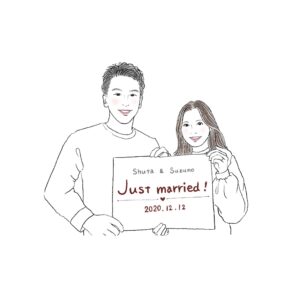 Just married!結婚記念のプレートを持つふたり