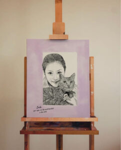 女性と猫の似顔絵