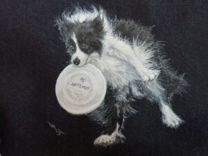 布に書き込まれた愛犬の姿