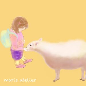 ヤギに餌をあげている子供