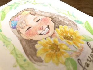 ひまわりを持った女の子の似顔絵