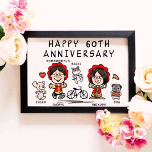 「HAPPY 60TH ANNIVERSARY　お仕事お疲れ様でした」の文字、おそろいの赤い頭巾をかぶった夫婦とペットのキャラ風似顔絵