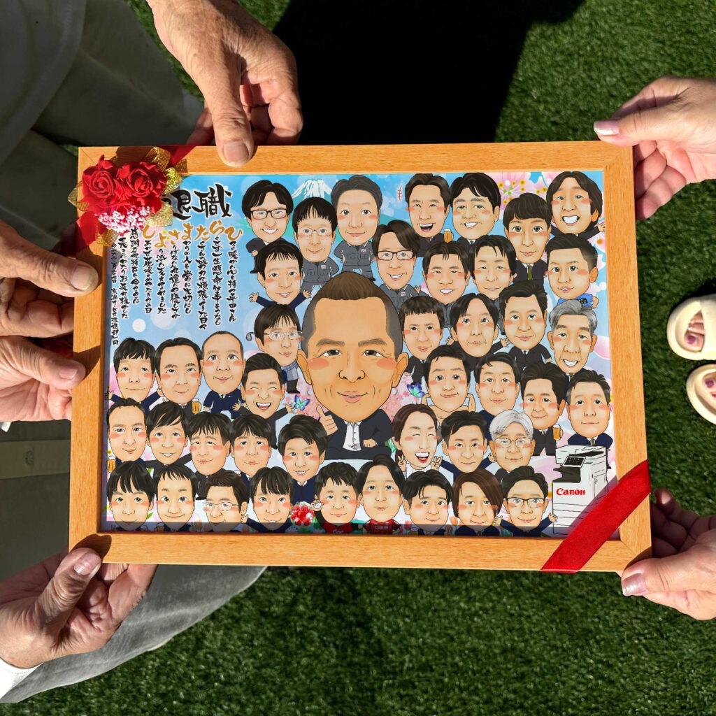 退職する上司を職場の仲間全員で囲んで祝う似顔絵